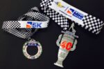 Thumbnail for the post titled: 2016 OneAmerica 500 Festival Mini-Marathon and Finish Line 500 Festival 5K medals pay tribute to 100th Running of the Indy 500