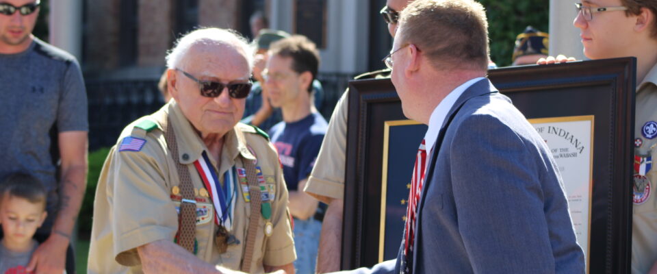 Bill Shideler and Randy Head shake hands at Cass County Memorial Day Parade.