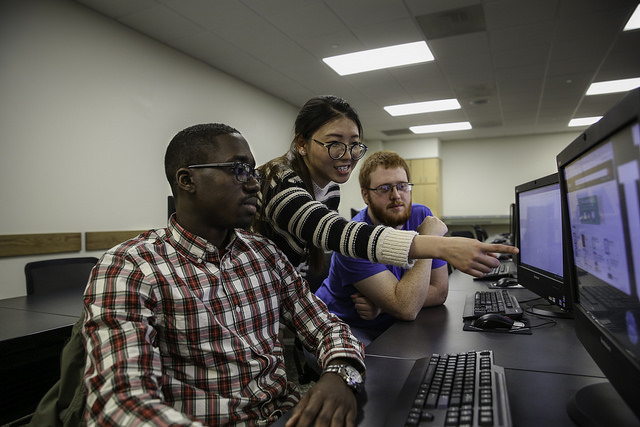 Three students at computers