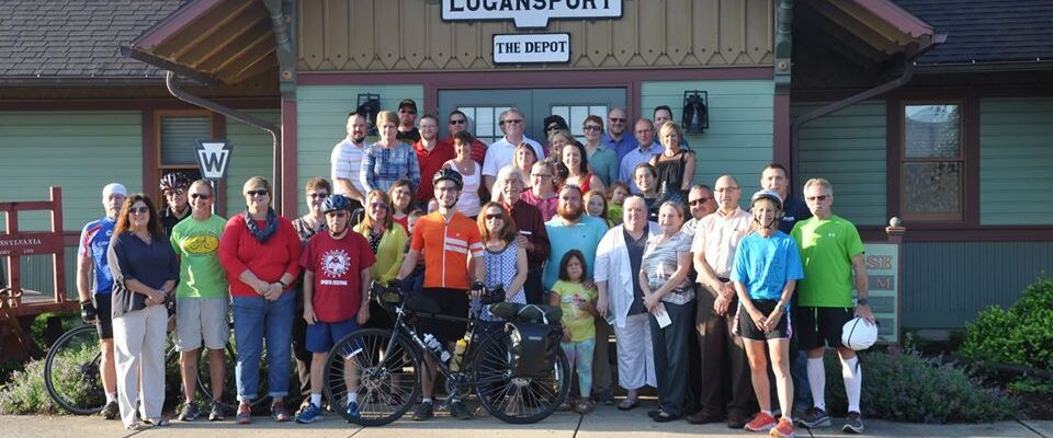 Group with Aaron Anderson as he departs Logansport by bike to raise money for Logan's Landing