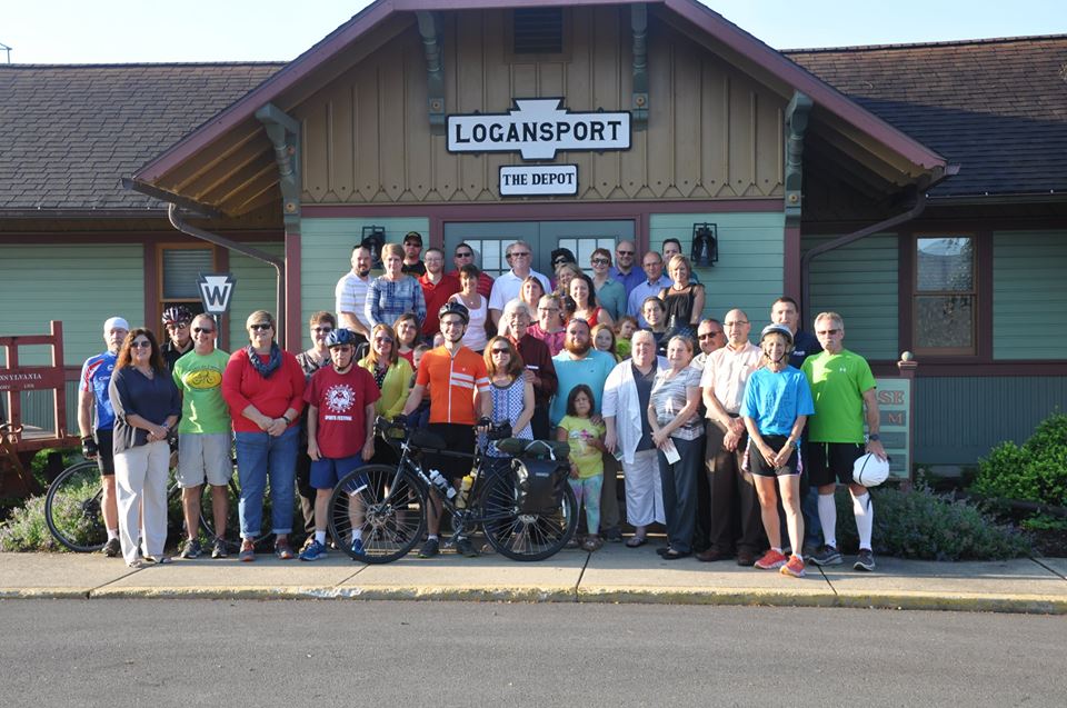 Group with Aaron Anderson as he departs Logansport by bike to raise money for Logan's Landing
