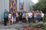 Large group at ribbon cutting for Logansport art installation