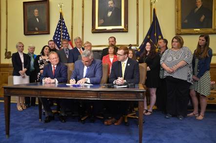 Thumbnail for the post titled: Head joins Gov. Holcomb for signing of school bus safety bill