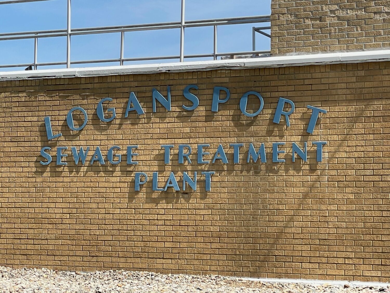 Brick building with signage that reads Logansport Sewage Treatment Plant