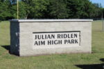 Julian Ridlen AIM High Park stone sign