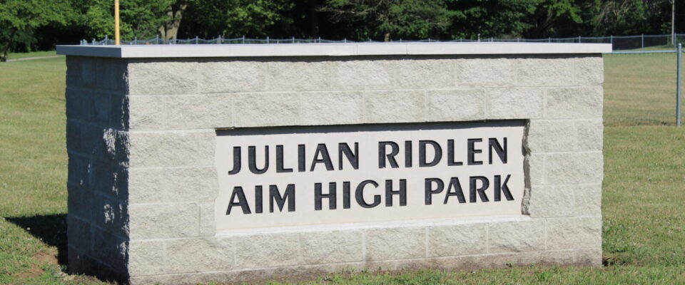 Julian Ridlen AIM High Park stone sign